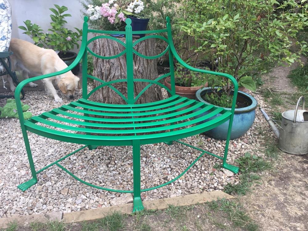 Curved metal bench after refurbishment.