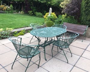 Green table and chairs before refurbishment.